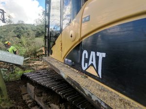 Cat Digger with tree fell equipment